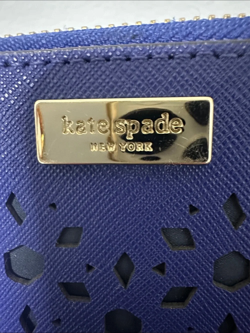 EUC kate spade cobalt blue laser-cut zip wallet with gold logo and Gold Zipper